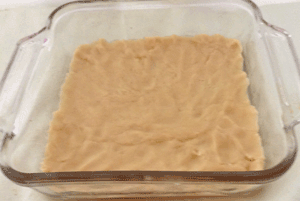 Dough applied to base of baking pan