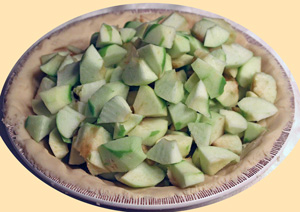  Apples piled onto pastry base