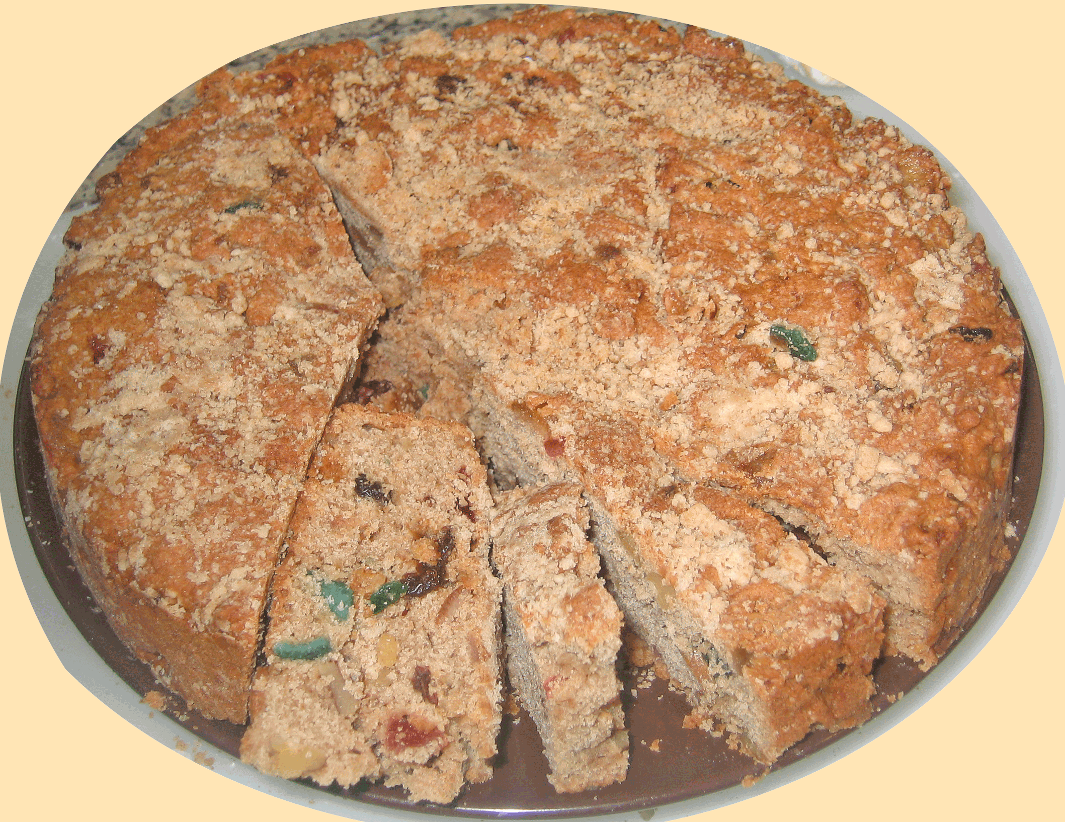  The large fruit cake with some slices as well